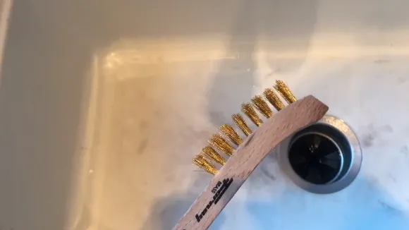 Scrub the Surface of the Sink with the Sponge or Brush
