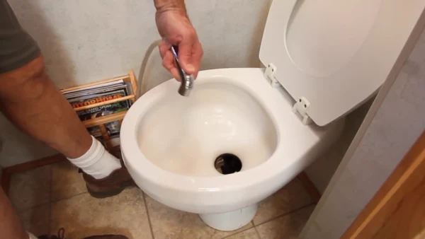 What happens when you flush a toilet in an RV while driving
