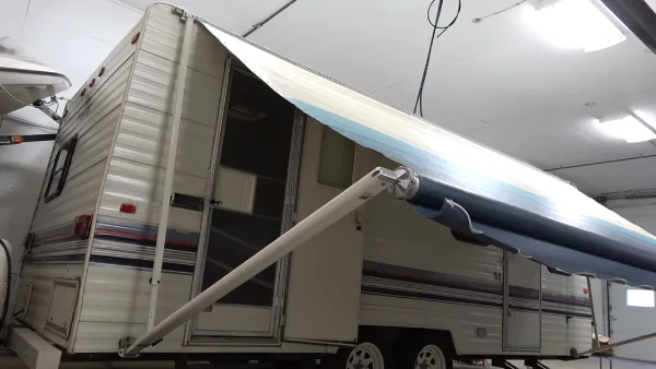 What is the life expectancy of an RV awning for estimating replacement needs
